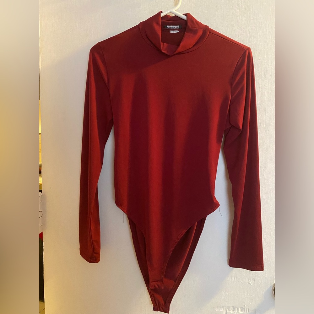 Maroon bodysuit with high neck and open back